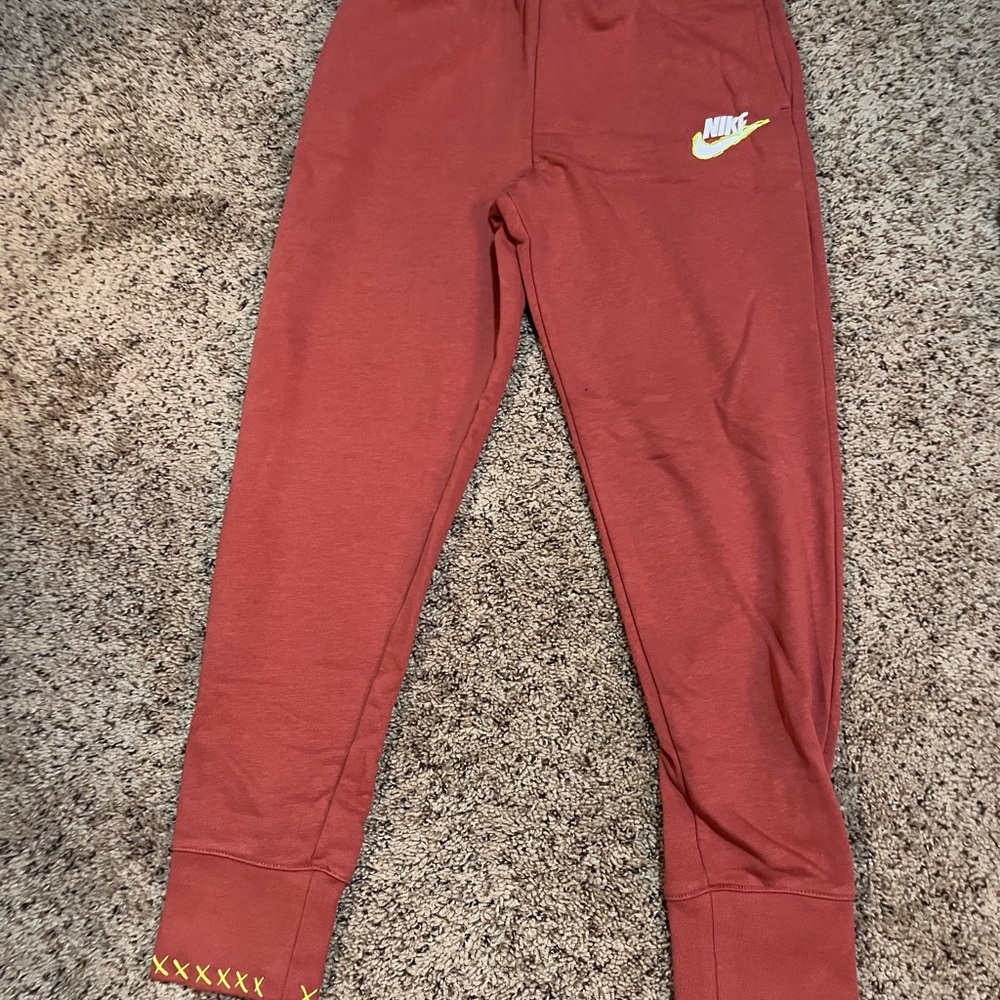 Nike Kids Rust Red Joggers with Yellow Accents